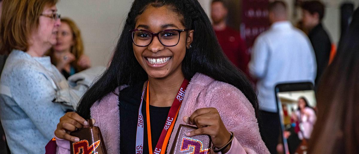 Enrolling student rings the bell 